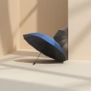 The blue and black dual-color folding umbrella is waterproof, sun-proof, portable and lightweight Application Scenario